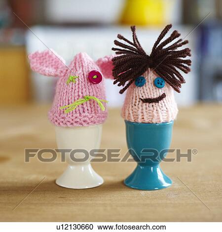 Stock Image - Knitted egg warmers couple. Fotosearch