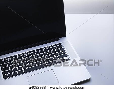 Picture - Laptop Computer on desk. Fotosearch