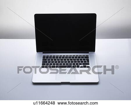 Stock Photo - Laptop Computer on desk. Fotosearch