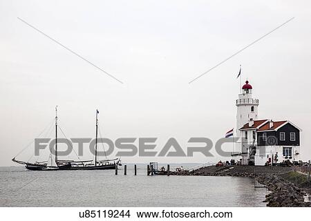 Lighthouse and sailing boats, Marken, Netherlands View Large Photo Image Picture - Lighthouse and sailing boats, Marken, Netherlands. Fotosearch