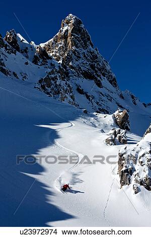 Picture - Man skiing in Davos, Switzerland. Fotosearch