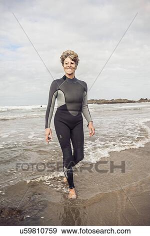 Mature female paddling on Devon coast, UK View Large Photo Image Stock Photo - Mature female paddling on Devon coast, UK. Fotosearch