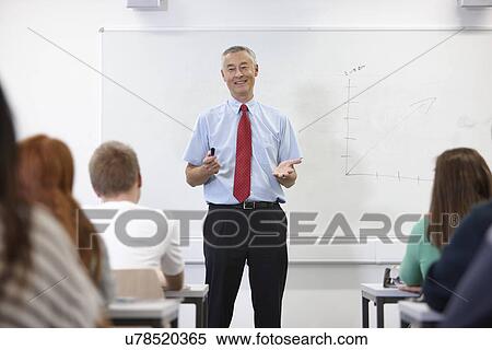 Mature male teacher in front of class View Large Photo Image Stock Photography - Mature male teacher in front of class. Fotosearch