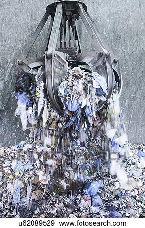 Mechanical grabber and pile of scrap metal View Large Photo Image Stock Photo - Mechanical grabber and pile of scrap metal. Fotosearch