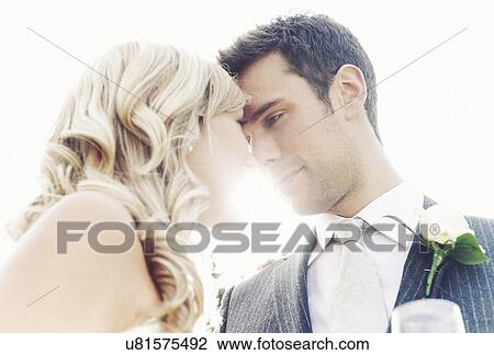 Newlywed couple touching noses View Large Photo Image Stock Image - Newlywed couple touching noses. Fotosearch