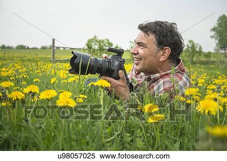 Stock Photography - Photographer in field. Fotosearch