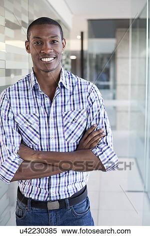 Portrait of businessman wearing casual clothes, arms folded View Large Photo Image Stock Photography - Portrait of businessman wearing casual clothes, arms folded. Fotosearch