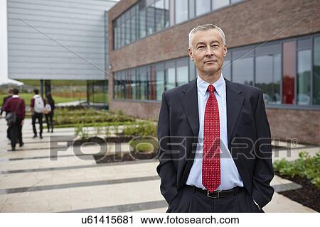 Portrait of mature male teacher outside school View Large Photo Image Stock Image - Portrait of mature male teacher outside school. Fotosearch