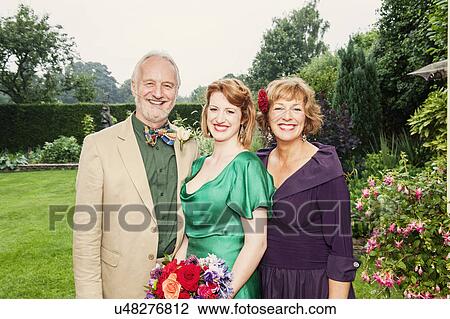 Portrait of newly married daughter with her parents View Large Photo Image Stock Image - Portrait of newly married daughter with her parents. Fotosearch