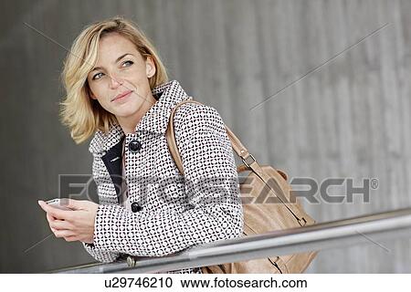 Portrait of office worker on stairway View Large Photo Image Stock Image - Portrait of office worker on stairway. Fotosearch