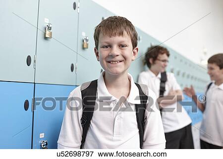 Portrait of schoolboy in corridor View Large Photo Image Stock Photo - Portrait of schoolboy in corridor. Fotosearch