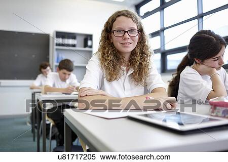 Portrait of schoolgirl in classroom View Large Photo Image Stock Photography - Portrait of schoolgirl in classroom. Fotosearch
