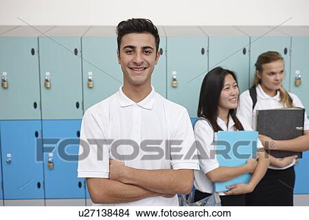 Portrait of teenage schoolboy next to lockers View Large Photo Image Picture - Portrait of teenage schoolboy next to lockers. Fotosearch