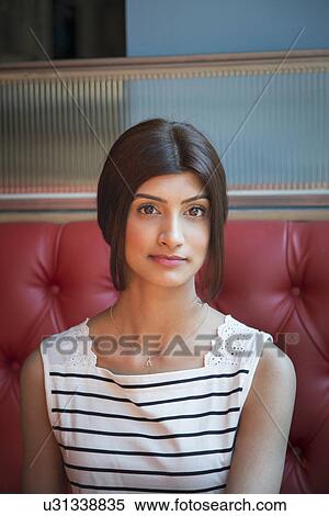 Stock Photography - Portrait of woman wearing striped vest. Fotosearch