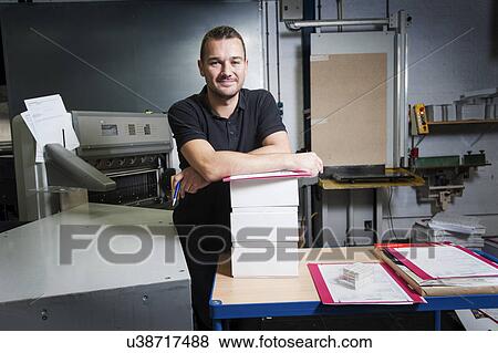 Portrait of worker in paper printing workshop View Large Photo Image Stock Photo - Portrait of worker in paper printing workshop. Fotosearch
