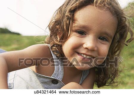Portrait of young boy with brown hair, smiling View Large Photo Image Picture - Portrait of young boy with brown hair, smiling. Fotosearch