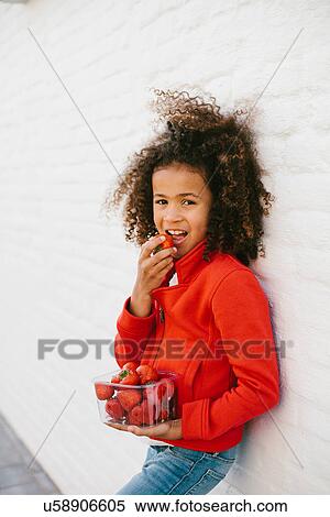 Portrait of young girl with strawberries View Large Photo Image Stock Photography - Portrait of young girl with strawberries. Fotosearch