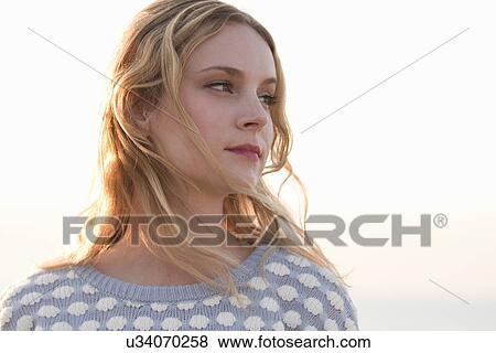 Portrait of young woman at coast, Whitstable, Kent, UK View Large Photo Image Stock Photo - Portrait of young woman at coast, Whitstable, Kent, UK. Fotosearch