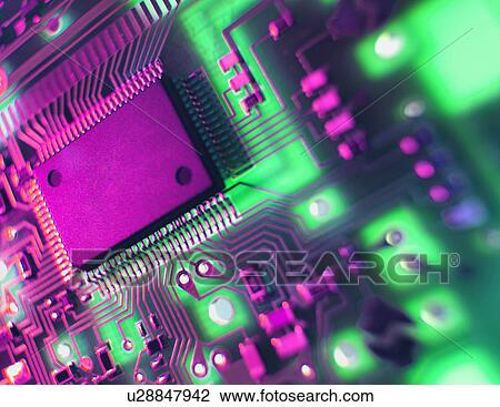 Stock Image - Printed Circuit Board. The central processing unit interprets and executes software instructions. Fotosearch