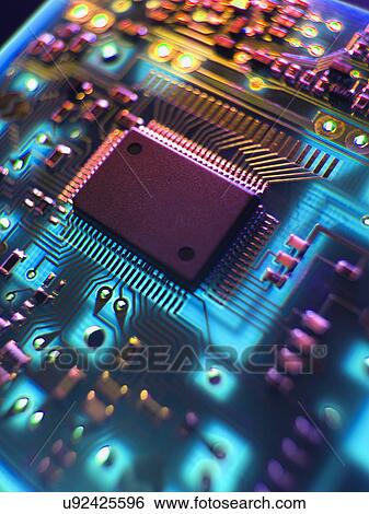 Printed Circuit Board. The central processing unit interprets and executes software instructions View Large Photo Image Stock Photograph - Printed Circuit Board. The central processing unit interprets and executes software instructions. Fotosearch