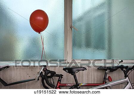Red balloon tied to bicycle View Large Photo Image Stock Image - Red balloon tied to bicycle. Fotosearch