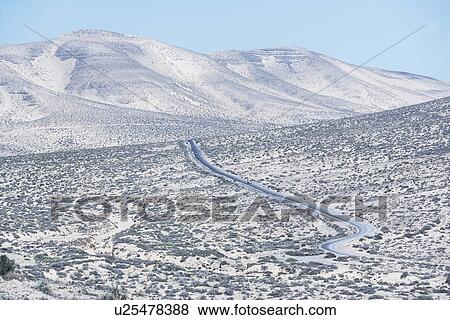 Stock Photo - Road winding through Fuerteventura landscape, Canary Islands, Spain. Fotosearch