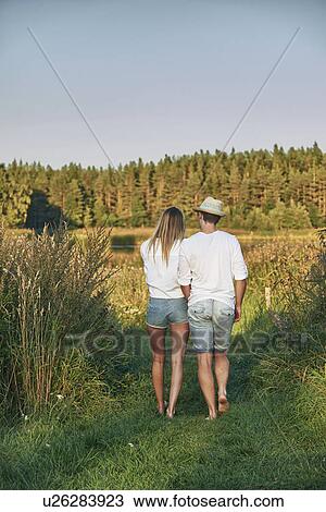 Stock Image - Romantic young couple strolling, Gavle, Sweden. Fotosearch