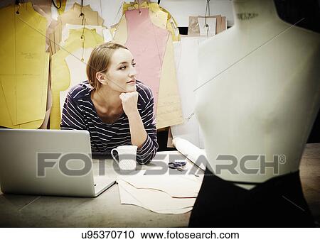 Seamstress working at table View Large Photo Image Stock Image - Seamstress working at table. Fotosearch