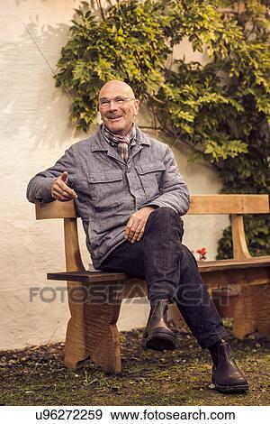 Senior man sitting on bench View Large Photo Image Stock Photo - Senior man sitting on bench. Fotosearch