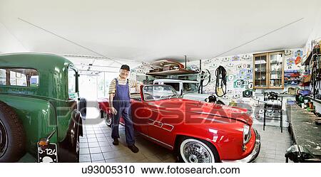Senior man with vintage car in workshop View Large Photo Image Stock Image - Senior man with vintage car in workshop. Fotosearch