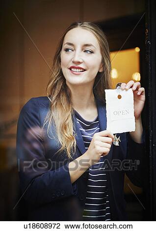 Shop owner with open sign View Large Photo Image Stock Image - Shop owner with open sign. Fotosearch