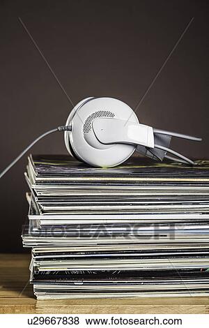 Stack of vinyl records with headphones View Large Photo Image Stock Photo - Stack of vinyl records with headphones. Fotosearch