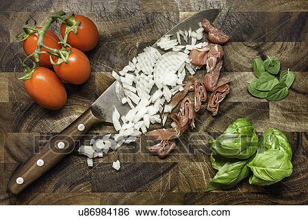 Still life of chopped onion and ham with tomatoes and herbs View Large Photo Image Stock Photograph - Still life of chopped onion and ham with tomatoes and herbs. Fotosearch