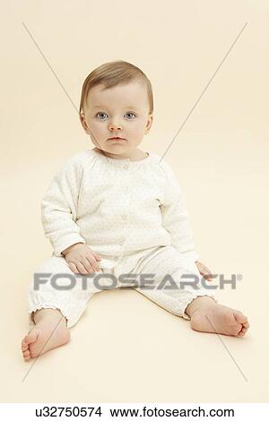 Studio portrait of baby girl staring at camera View Large Photo Image Picture - Studio portrait of baby girl staring at camera. Fotosearch