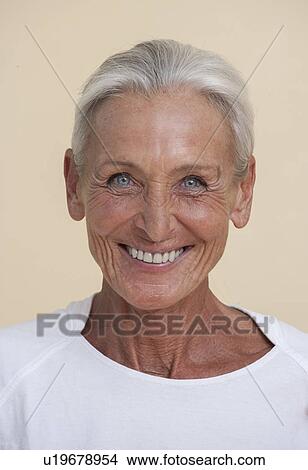 Studio portrait of senior woman smiling View Large Photo Image Picture - Studio portrait of senior woman smiling. Fotosearch