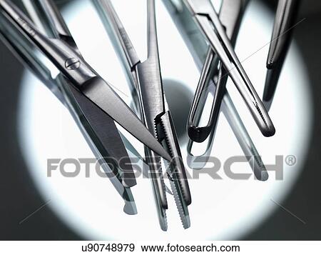 Stock Photo - Surgical instruments on sterile tray with reflection of theatre light. Fotosearch