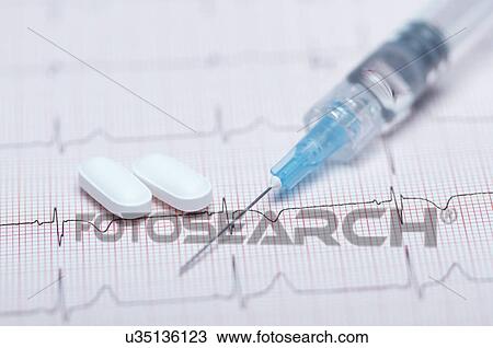 Syringe, pills and healthy electrocardiogram View Large Photo Image Stock Image - Syringe, pills and healthy electrocardiogram. Fotosearch