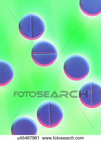 Stock Image - Tablets on colourful background. Fotosearch