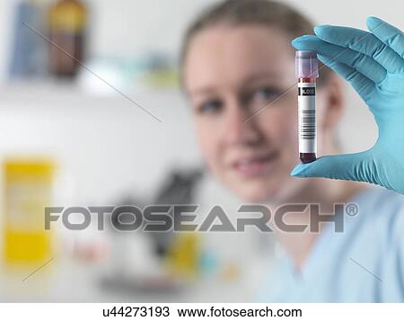 Technician holding bar coded blood sample in clinical laboratory View Large Photo Image Stock Image - Technician holding bar coded blood sample in clinical laboratory. Fotosearch