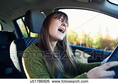 Teenage girl in car singing along to music View Large Photo Image Stock Photograph - Teenage girl in car singing along to music. Fotosearch