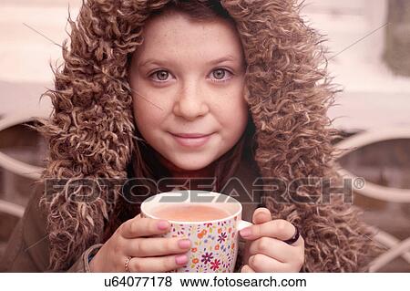 Teenage girl with mug of coffee outdoors View Large Photo Image Stock Photo - Teenage girl with mug of coffee outdoors. Fotosearch
