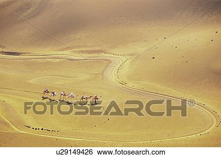 Tourists riding camels, Timanfaya National Park, Lanzarote, Canary Islands, Spain View Large Photo Image Stock Photograph - Tourists riding camels, Timanfaya National Park, Lanzarote, Canary Islands, Spain. Fotosearch