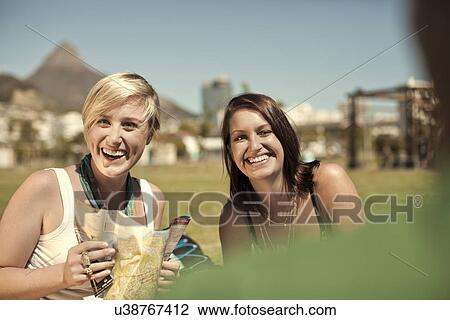 Two young women with map, Cape Town, South Africa View Large Photo Image Stock Image - Two young women with map, Cape Town, South Africa. Fotosearch