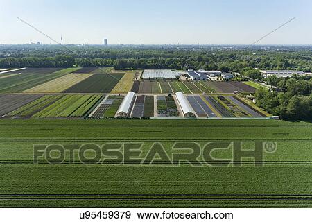 Stock Photo - View of agriculture and greenhouses, Munich, Bavaria, Germany. Fotosearch