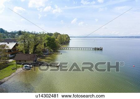 View of pier on Lake Starnberg, Bavaria, Germany View Large Photo Image Stock Image - View of pier on Lake Starnberg, Bavaria, Germany. Fotosearch