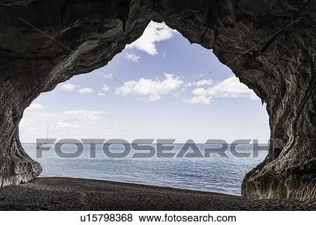 View through natural arch, Cala Luna, Sardinia, Italy View Large Photo Image Stock Photo - View through natural arch, Cala Luna, Sardinia, Italy. Fotosearch