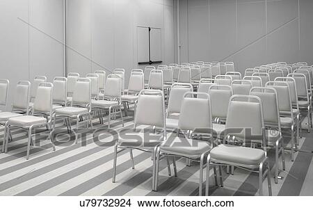 White chairs in empty auditorium View Large Photo Image Picture - White chairs in empty auditorium. Fotosearch
