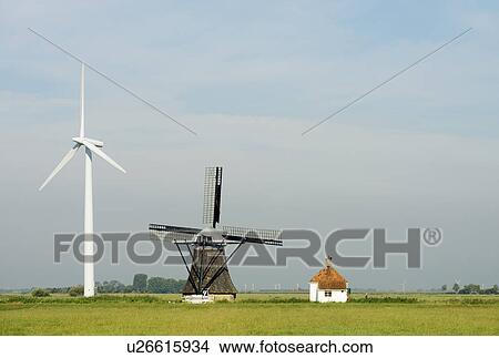 Picture - Wind turbine and windmill, Tjerkwerd, Friesland, Netherlands. Fotosearch