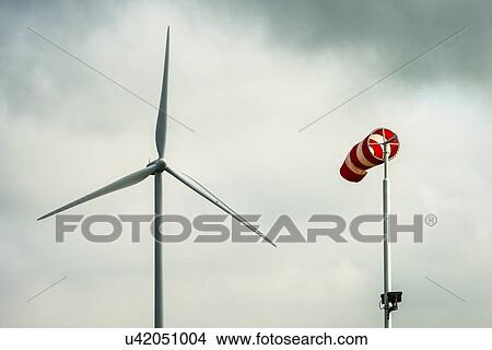 Wind turbine and windsock, Zeeland, Netherlands View Large Photo Image Picture - Wind turbine and windsock, Zeeland, Netherlands. Fotosearch
