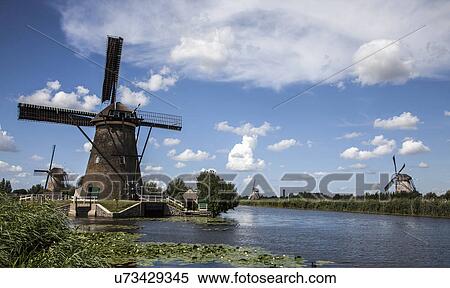 Windmills and waterways, Kinderdijk, Netherlands View Large Photo Image Stock Photography - Windmills and waterways, Kinderdijk, Netherlands. Fotosearch